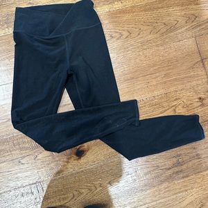 Vuori leggings very soft. Slight wear and a very small whole in the leg
